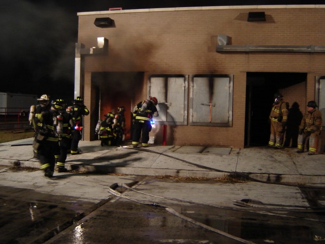 MCFA Live Burn 04/06 - The hose team prepares to enter the structure